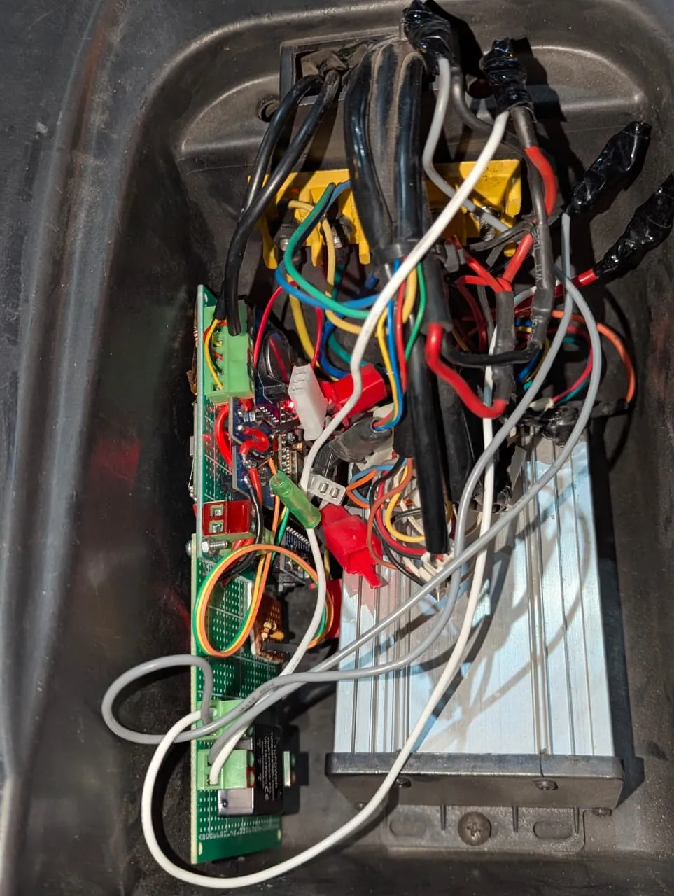 Telemetry electronics wired into the e-bike's battery and controller compartment