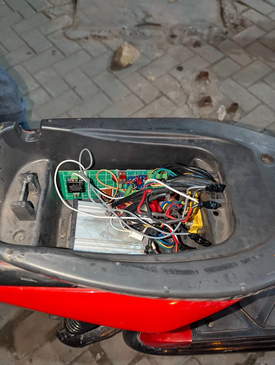 Prototype telemetry board wired in under the e-bike seat
