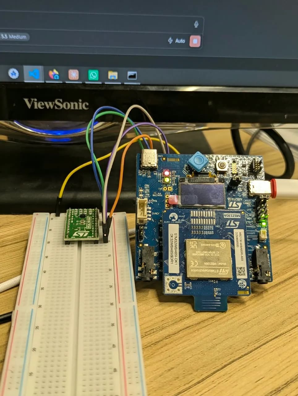 STM32 development board wired to an IMU sensor breakout on a breadboard