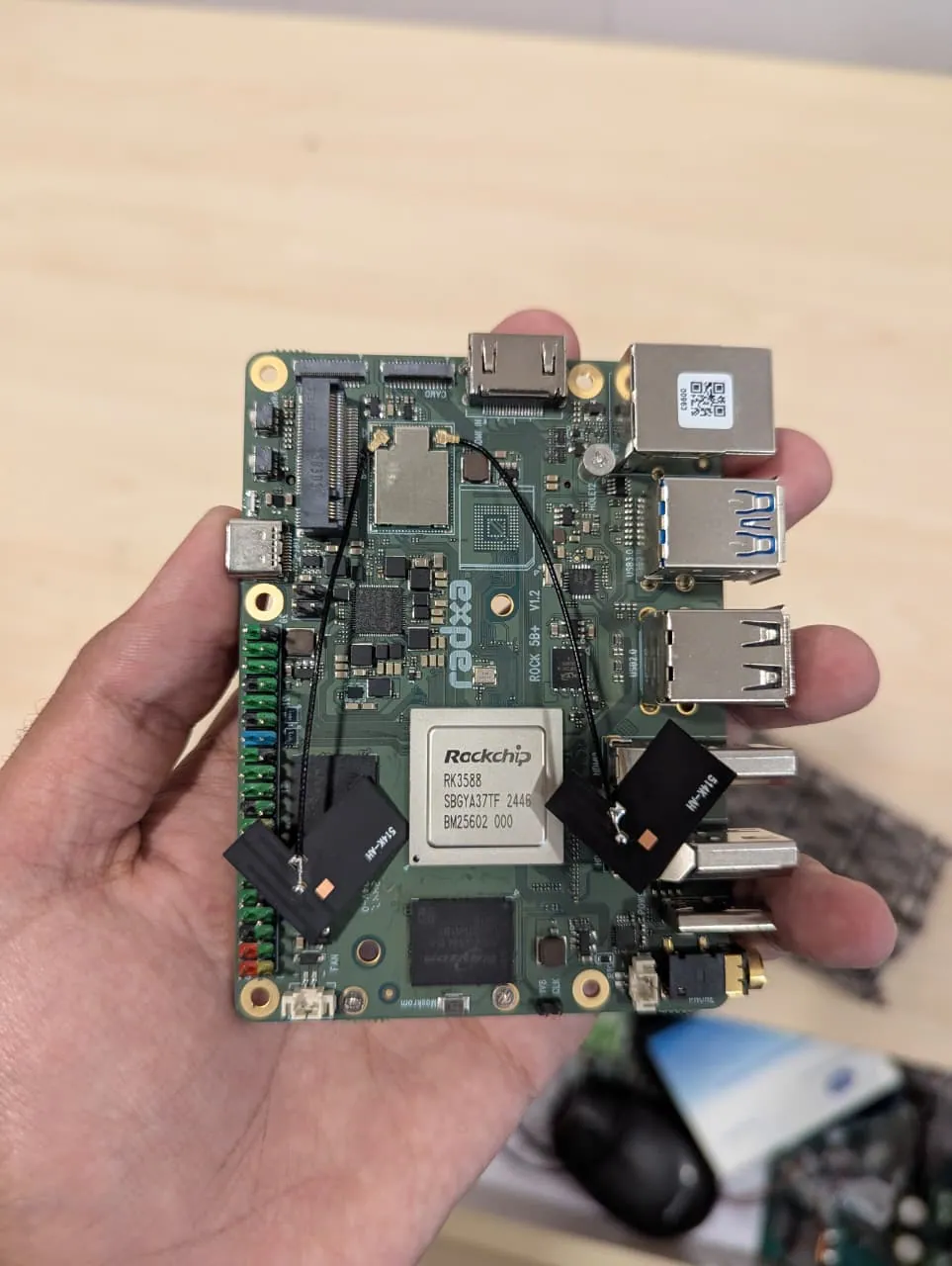 Rockchip RK3588 single-board computer held in hand